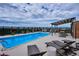 Relaxing rooftop pool with city views and lounge chairs at 1133 Race St # 1B, Denver, CO 80206