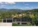 Modern house with mountain views and a three-car garage at 7142 Lynx Lair Rd, Evergreen, CO 80439