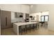 Modern kitchen with large island, wood cabinets and a spacious dining area at 7142 Lynx Lair Rd, Evergreen, CO 80439