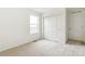 Bright bedroom with carpet flooring, large closet, and a window at 9374 Bahama Ct, Commerce City, CO 80022