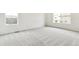 Simple bedroom with carpet, large window and neutral walls at 9374 Bahama Ct, Commerce City, CO 80022