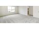 Bright bedroom with a large window offering ample natural light and neutral carpet at 9374 Bahama Ct, Commerce City, CO 80022