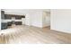 Open concept kitchen with dark cabinets and stainless steel appliances at 9374 Bahama Ct, Commerce City, CO 80022