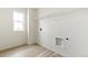 Laundry room with wood-look flooring, shelving and hookups at 9374 Bahama Ct, Commerce City, CO 80022