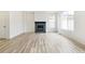 Living room with a modern fireplace and hardwood floors at 9374 Bahama Ct, Commerce City, CO 80022