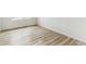 Spare bedroom with light wood flooring and a large window at 9374 Bahama Ct, Commerce City, CO 80022