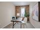 Home office featuring exposed brick and modern workspace at 1511 E 37Th Ave, Denver, CO 80205