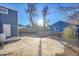 Large backyard with concrete patio and detached garage at 1373 S Wolff St, Denver, CO 80219