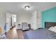 Bedroom with gray carpet and access to another room at 1373 S Wolff St, Denver, CO 80219