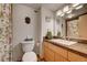 Clean bathroom with a vanity, toilet, and shower at 1020 15Th St # 9E, Denver, CO 80202