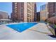 Inviting outdoor swimming pool with surrounding lounge chairs at 1020 15Th St # 9E, Denver, CO 80202