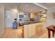 Open concept kitchen with breakfast bar and stainless steel appliances at 1020 15Th St # 9E, Denver, CO 80202
