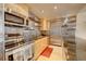Modern kitchen with stainless steel appliances and wood cabinets at 1020 15Th St # 9E, Denver, CO 80202