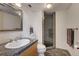 Bathroom with shower, toilet and granite countertop at 1020 15Th St # 9E, Denver, CO 80202