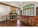 Rustic bar area with stone fireplace and leather barstools at 5700 Cherry Cir, Greenwood Village, CO 80121