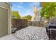 Small paved patio with built-in grill and storage shed at 8140 S Fillmore Cir, Centennial, CO 80122