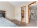 Bedroom with carpet flooring, and view of bathroom and hallway at 8140 S Fillmore Cir, Centennial, CO 80122