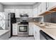 Kitchen with white cabinets and stainless steel appliances at 8140 S Fillmore Cir, Centennial, CO 80122
