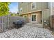 Stone patio with a built-in grill and access to the house at 8140 S Fillmore Cir, Centennial, CO 80122