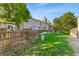 Landscaped backyard with wooden fence and grassy area at 8140 S Fillmore Cir, Centennial, CO 80122