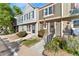 Front view of a two story townhome with landscaping at 8140 S Fillmore Cir, Centennial, CO 80122