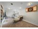 Finished basement with a sectional sofa and dartboard at 803 Poplar St, Denver, CO 80220