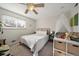 Charming bedroom with a ceiling fan and neutral decor at 803 Poplar St, Denver, CO 80220