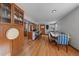 Open concept dining area with hardwood floors and built-in cabinetry at 803 Poplar St, Denver, CO 80220