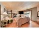 Cozy Gathering room boasting a brick fireplace and wood flooring at 6034 S Niagara Ct, Centennial, CO 80111