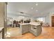 Spacious kitchen featuring a large island, updated cabinetry, and hardwood floors at 6034 S Niagara Ct, Centennial, CO 80111