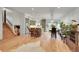 Open concept kitchen and dining area with hardwood floors and modern finishes at 6034 S Niagara Ct, Centennial, CO 80111