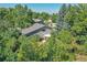 Aerial view showing home's setting amongst lush trees at 6034 S Niagara Ct, Centennial, CO 80111