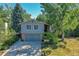 Two-story home with gray siding, a two-car garage and a large yard at 6034 S Niagara Ct, Centennial, CO 80111