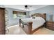 Bright bedroom with a large bed, dresser, and ceiling fan at 6034 S Niagara Ct, Centennial, CO 80111