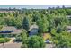 Aerial view of a house nestled among lush trees, offering a tranquil setting at 6034 S Niagara Ct, Centennial, CO 80111