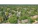 Aerial view of a residential neighborhood with a house surrounded by trees at 6034 S Niagara Ct, Centennial, CO 80111