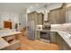 Modern kitchen with stainless steel appliances and ample counter space at 6034 S Niagara Ct, Centennial, CO 80111