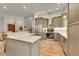 Modern kitchen with stainless steel appliances and large island at 6034 S Niagara Ct, Centennial, CO 80111
