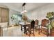 Charming dining area with hardwood floors and unique wood table and chairs at 6034 S Niagara Ct, Centennial, CO 80111