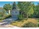 Two-story home with a gray exterior and a large, grassy yard at 6034 S Niagara Ct, Centennial, CO 80111