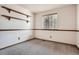 Small bedroom with wood trim and window coverings at 5698 S Quatar Ct, Centennial, CO 80015