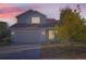 Two-story house with attached garage and landscaping at 5698 S Quatar Ct, Centennial, CO 80015