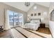 Spacious main bedroom with high ceilings, sliding glass doors to backyard, and hardwood floors at 314 Castlemaine Ct, Castle Rock, CO 80104