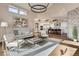 Open living room with a view into the kitchen and stone fireplace at 314 Castlemaine Ct, Castle Rock, CO 80104