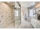 Spa-like bathroom with a large walk-in shower, soaking tub, and herringbone tile floors at 314 Castlemaine Ct, Castle Rock, CO 80104