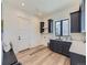 Functional laundry room with dark cabinetry and a built-in bench at 314 Castlemaine Ct, Castle Rock, CO 80104