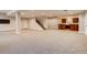 Finished basement with a wet bar, carpeted floors and a large open area at 314 Castlemaine Ct, Castle Rock, CO 80104