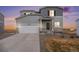 Two-story home with attached garage and landscaping at 42888 Ivydel St, Elizabeth, CO 80107