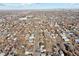 Aerial view of the suburban landscape, featuring streets, houses, and greenery at 2460 S Clay St, Denver, CO 80219