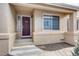 House entrance with a dark-red door and sidelights at 4924 S Newcombe Ct, Littleton, CO 80127